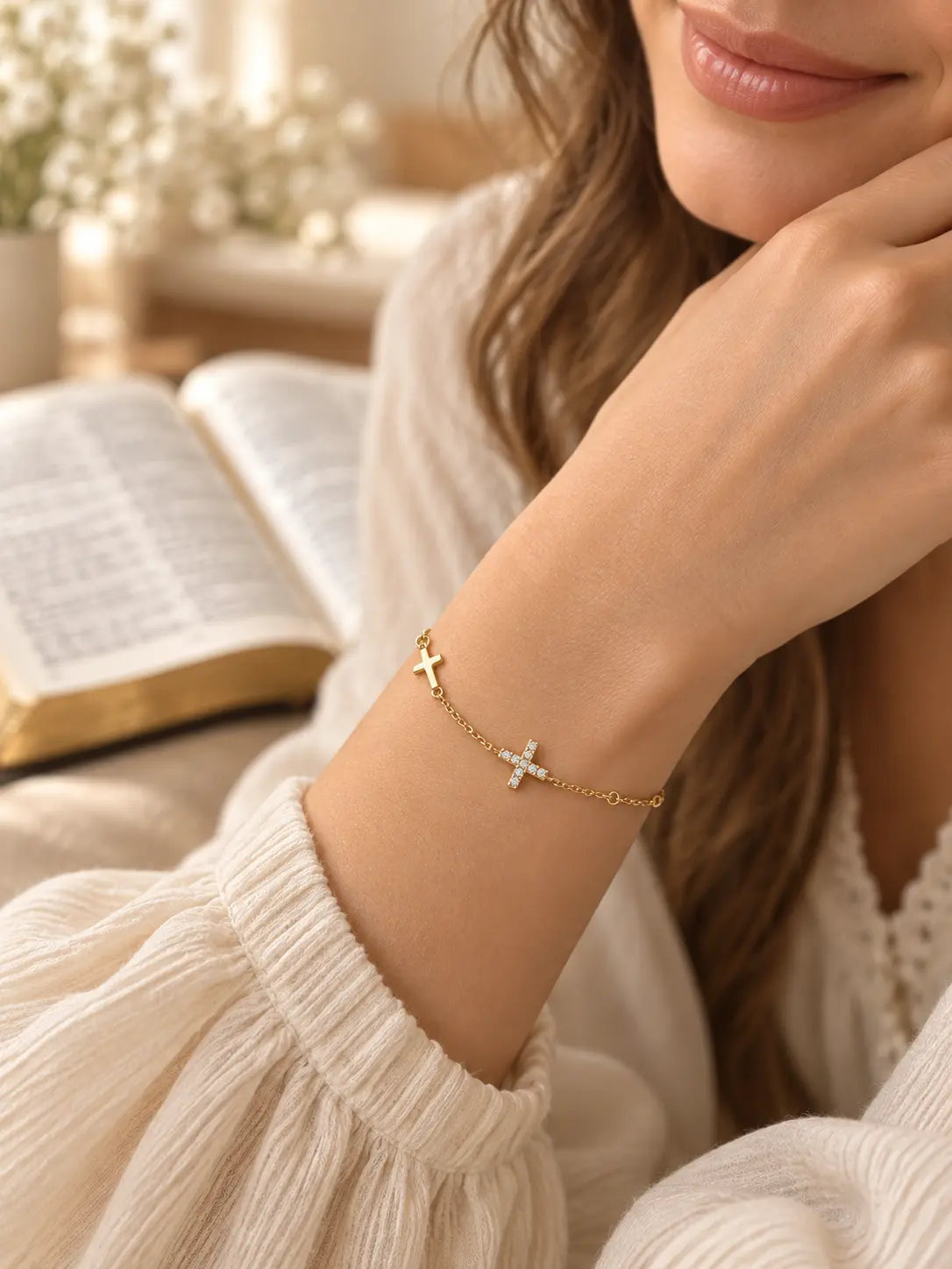 Model wearing the Dainty Gold Dual Cross Charm Bracelet, a delicate Christian faith bracelet with polished and crystal cross charms.