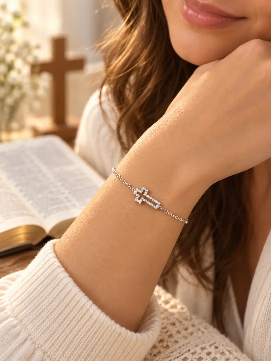 Woman wearing the Dainty Hollow Cross Bracelet, a delicate silver Christian faith bracelet with a sparkling hollow cross charm.