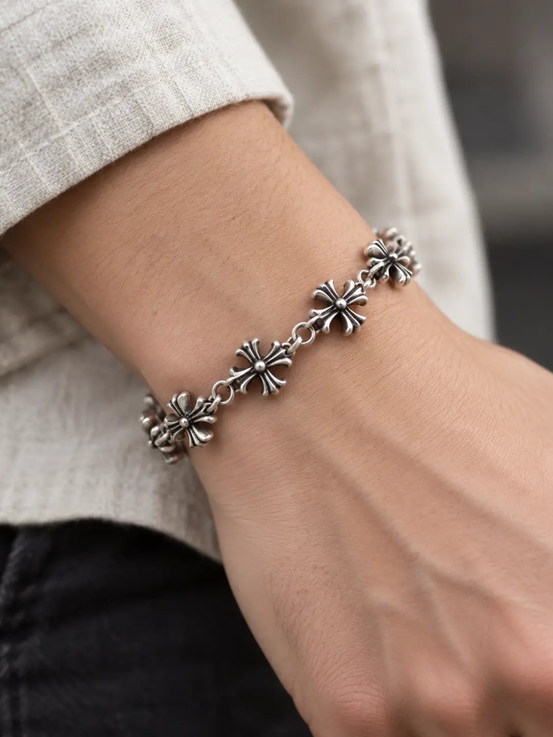 Model wearing the Gothic Retro Silver Cross Chain Bracelet, a vintage-inspired Christian faith bracelet with detailed silver cross motifs.