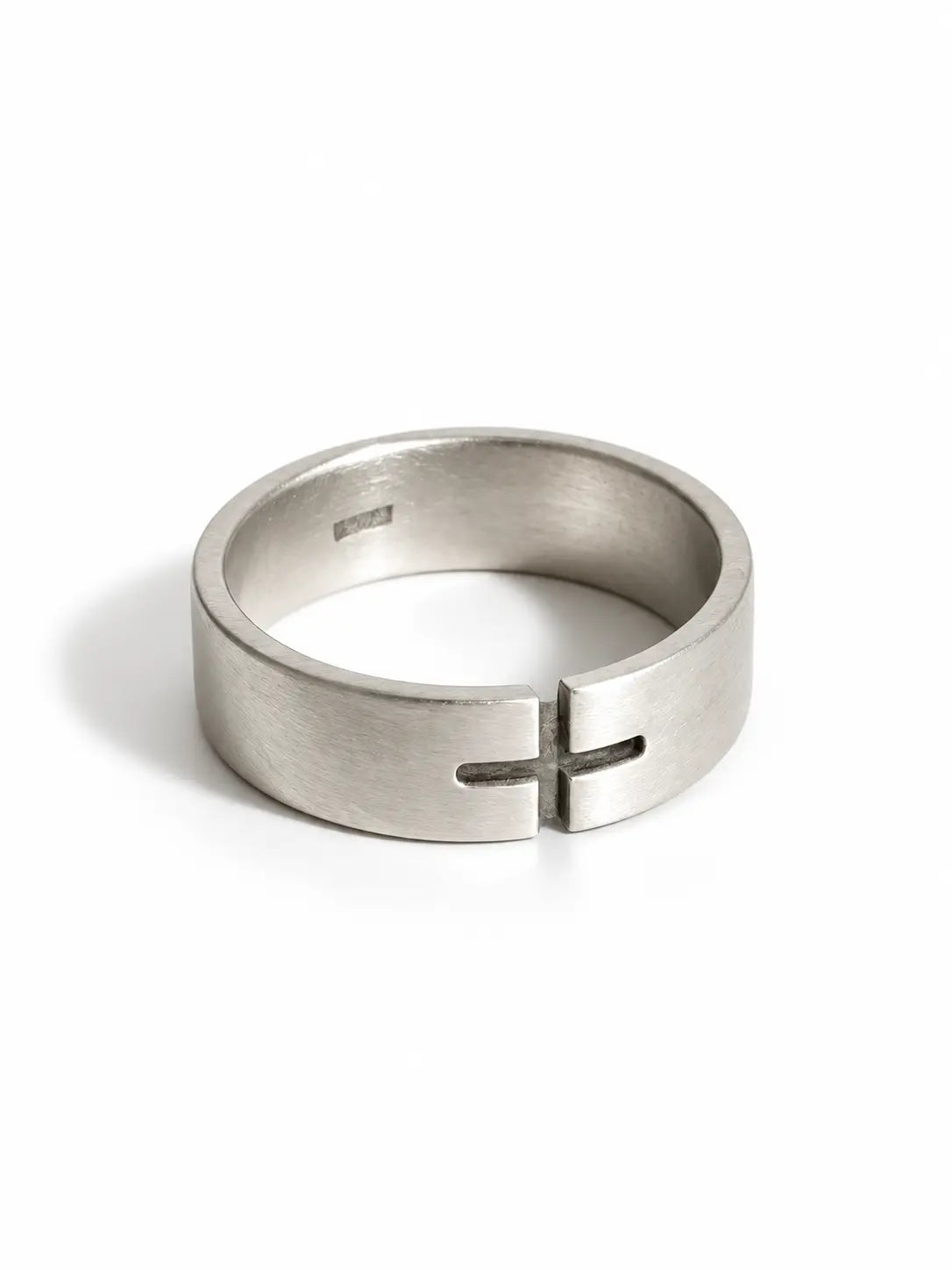 Minimalist Cross Ring in brushed silver finish on a white background, featuring a modern cutout cross design.