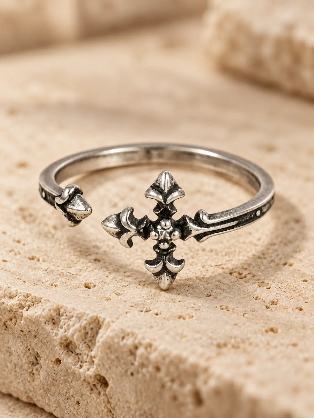 Close-up of Yeneast gothic cross open ring showing the ornate cross motif, oxidized finish and adjustable band design.