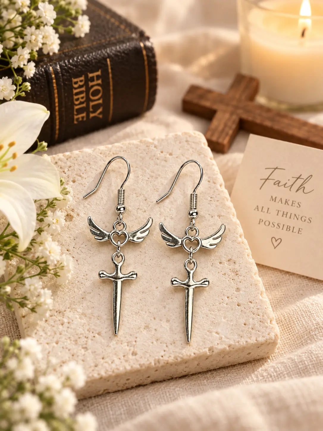 YENEAST silver angel wing sword earrings displayed as a meaningful faith inspired gift symbolizing love, protection and hope.