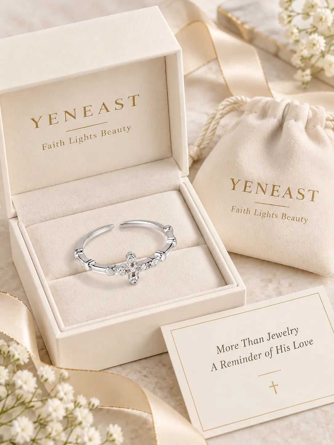 Yeneast dainty crystal cross open ring in a cream branded gift box with pouch and faith message card.