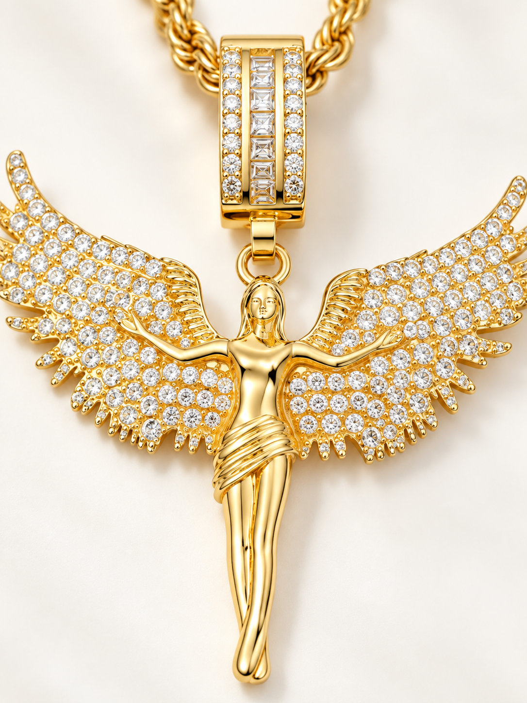 Close-up of the YENEAST Psalm 91 Angel Wing Necklace showing pavé crystal wings, polished gold angel figure and stone-set bail