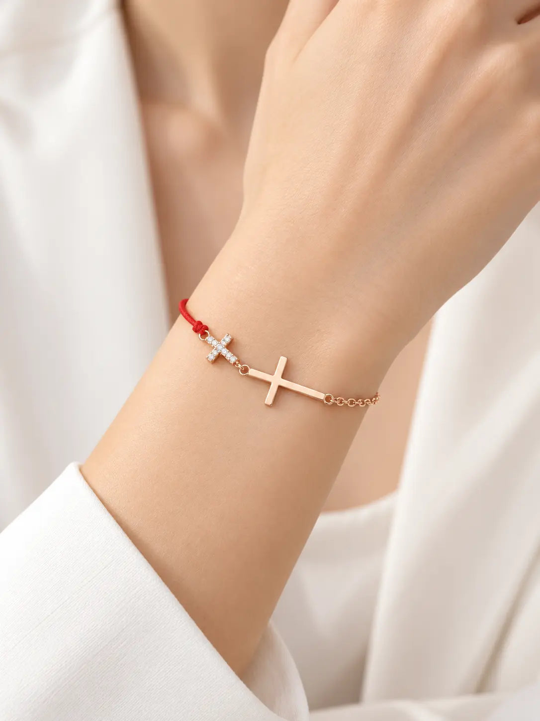 Woman wearing the YENEAST red cord cross bracelet with S925 sterling silver and cubic zirconia details
